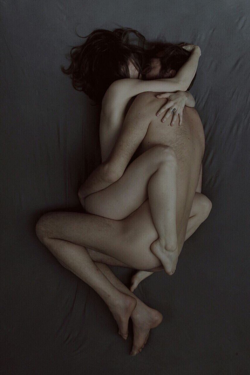 Naked couple cuddling